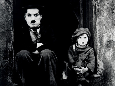 Charlie Chaplin as The Tramp and Jackie Coogan as The Kid in the 1921 classic, "The Kid" Charlie Chaplin as The Tramp and Jackie Coogan as The Kid in the 1921 classic, "The Kid"