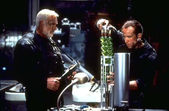 Cage extracts some beads of death while Connery restrains himself from blurting out the obvious dirty comment.